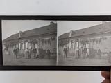 a black and white photo of a group of people in front of a building
