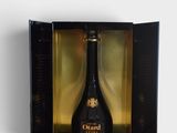 an open box with a bottle of wine inside of it