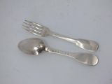 two silver spoons and a fork on a white surface