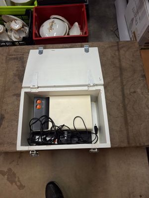 a box that has a laptop in it on the floor