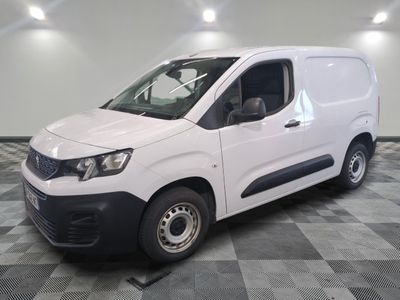 the white van is parked on a checkered tile floor