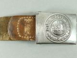 belt buckle with a silver buckle with a picture of a man on it