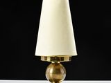 a close up of a lamp on a table with a black background