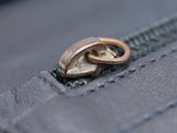 a close up of a ring on the inside of a wallet
