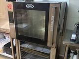a small oven that is in the middle of a kitchen
