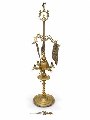 an image of a gold plated clock with a bell on a stand