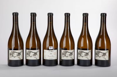six bottles of wine are lined up in a row