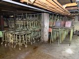 many chairs and tables in a room that is flooded with water