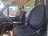 a black seat in the back of a white van