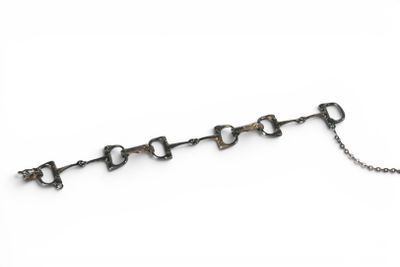 a close up of a metal chain with a key on it