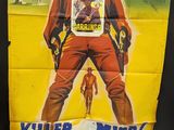 an old movie poster of a man in a cowboy outfit holding a gun