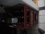 a wine rack that has a bunch of bottles in it