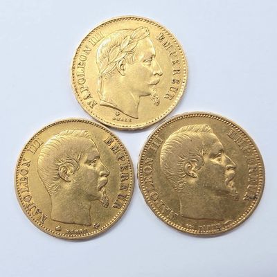 three gold sovereigns, one of which is a sovereign and the other of which is a sovereign