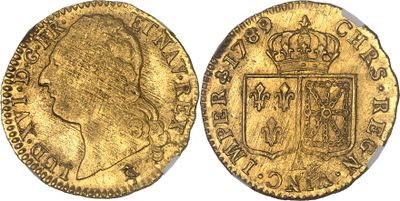 une pièce souveraine en or surmontée d'une couronne