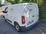 a white van that is parked on the side of the road