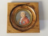 painting of a portrait of a man in a red coat in a wooden frame