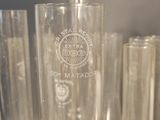a lot of glasses that are sitting on a table
