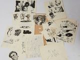 a lot of drawings and pictures on the table