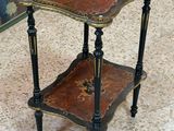 a small side table with a decorative design on it