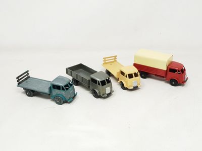 four toy cars that are sitting next to each other