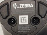 a close up of a black electronic device on a table