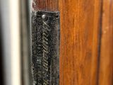 a close up of a wooden door with a sign on it