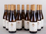 six bottles of wine are lined up in a row