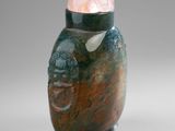 an image of a stone vase with a pink stone in the top