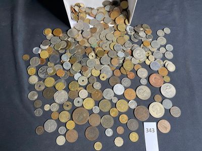 a box full of coins sitting on a table with a price tag