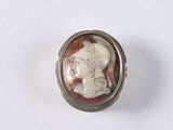 an image of a picture of a woman ' s face in a silver ring