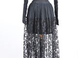 a black lace dress with long sleeves and a high neckline