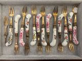many forks and spoons that are in a box