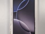 an image of a box with a phone in it on a white surface