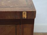 a close up of a wooden desk with a drawer