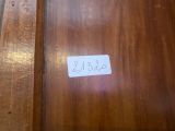 a label on the door of a wooden cabinet