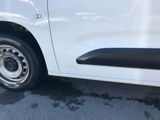 a white van that is parked in a parking lot