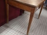 a table that is sitting on the floor in front of a couch