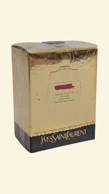 a gold box with a black lid on a white background