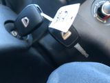 a car key attached to a remote control in a car