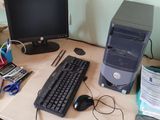 a desktop computer sitting on a desk with a keyboard and mouse