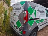 a van that is parked in front of a building