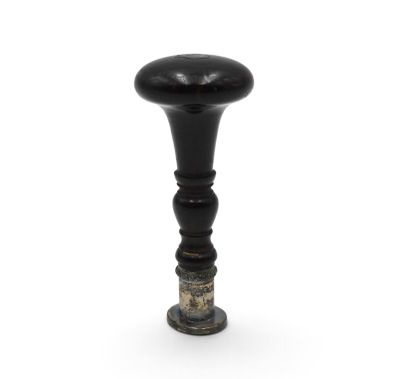 a close up of a black and gold vase on a white background