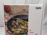 packaging of a cookware box with a picture of a vegetable dish inside of it