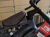 a close up of a bicycle with a bag on the handlebar