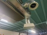 a camera that is hanging from the ceiling of a building