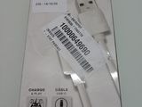 cable connected to a charger in a white box on a table