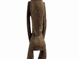 statue of a man standing on a pedestal with a hat on his head