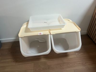 two sinks in the middle of a bathroom with a wooden floor