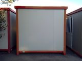two portable buildings sitting next to each other in a parking lot