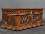 an old wooden chest with carvings on the sides of it